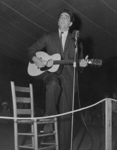 Alan Lomax playing guitar