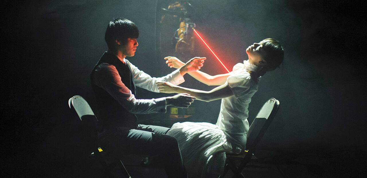 Huang Yi painstaking programs his robotic arm, KUKA, to dance along with him