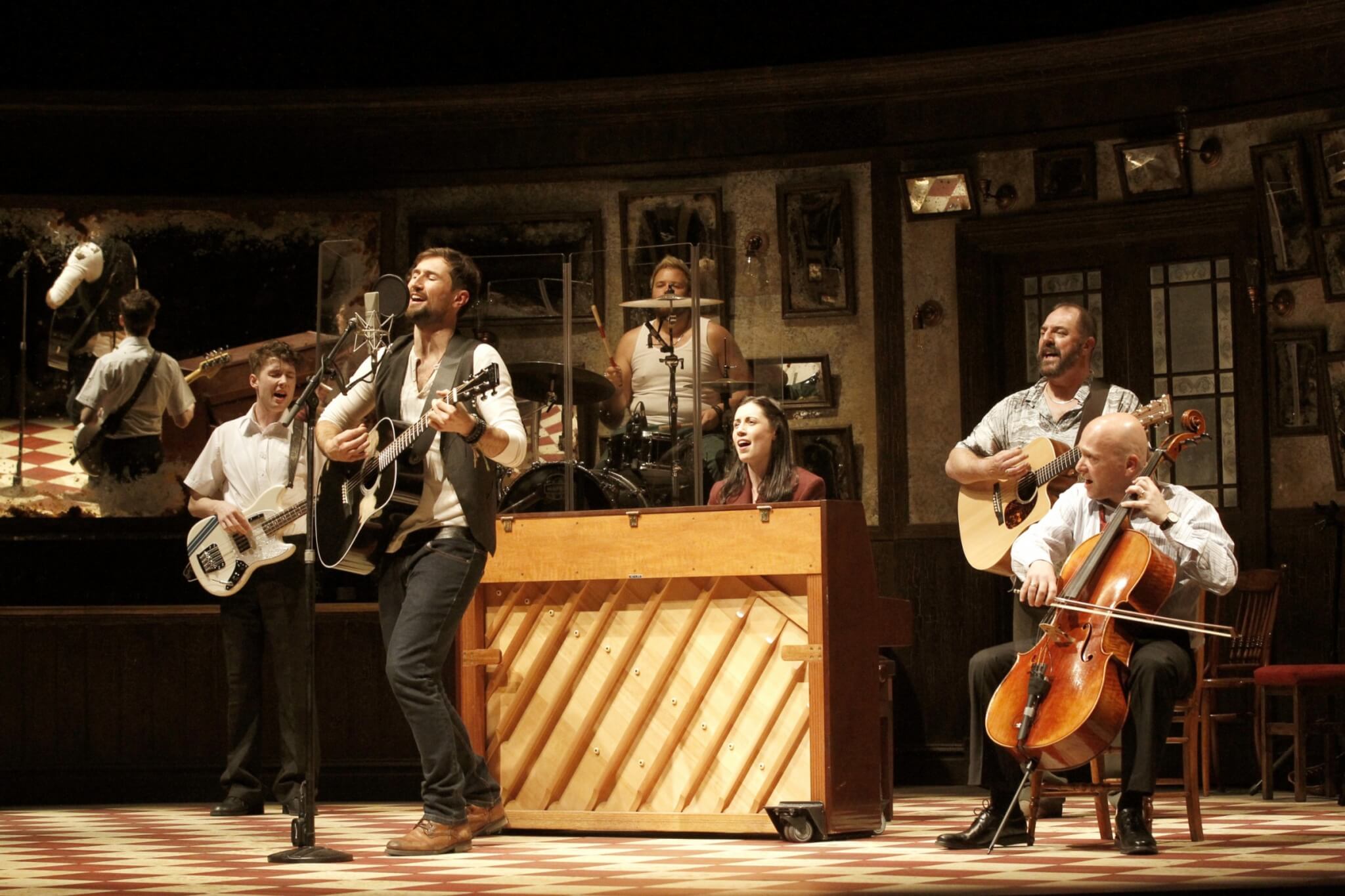 Cast of Once playing instruments