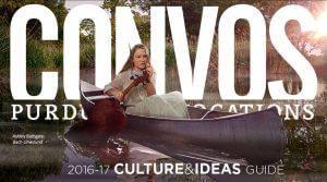 Ashley Bathgate paddling a canoe with a cello