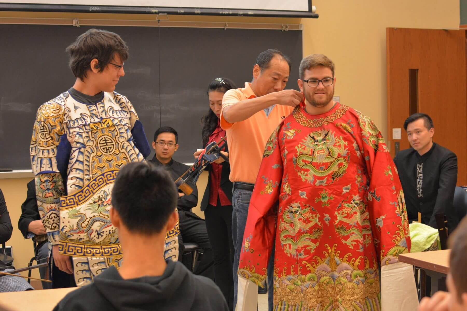 Members of Shanghai Jingju Theatre Company dress Purdue students in Peking Opera costumes