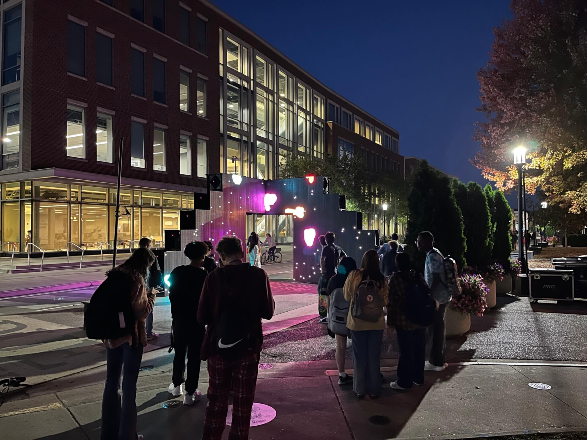 StairWELL led wall installation at night in front of Purdue's Krach Leadership Center