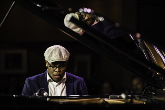 Isaiah J. Thompson playing piano