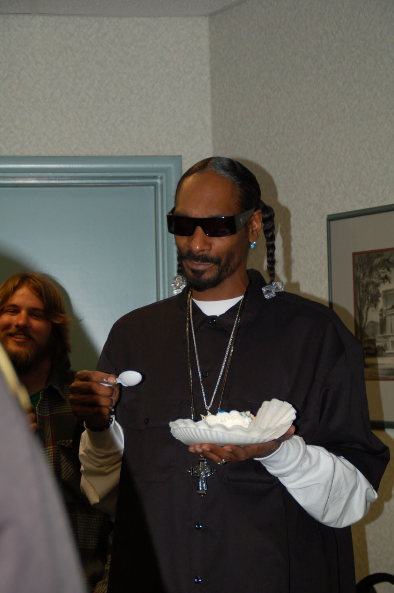 Snoop Dogg eating birthday cake backstage after his performance at Purdue on his birthday, October 20, 2010