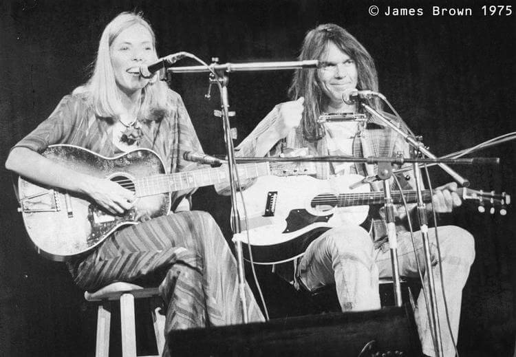 Singer Joni Mitchell invited Neil Young to perform during the encore of her concert in Elliott Hall of Music, January 18, 1976