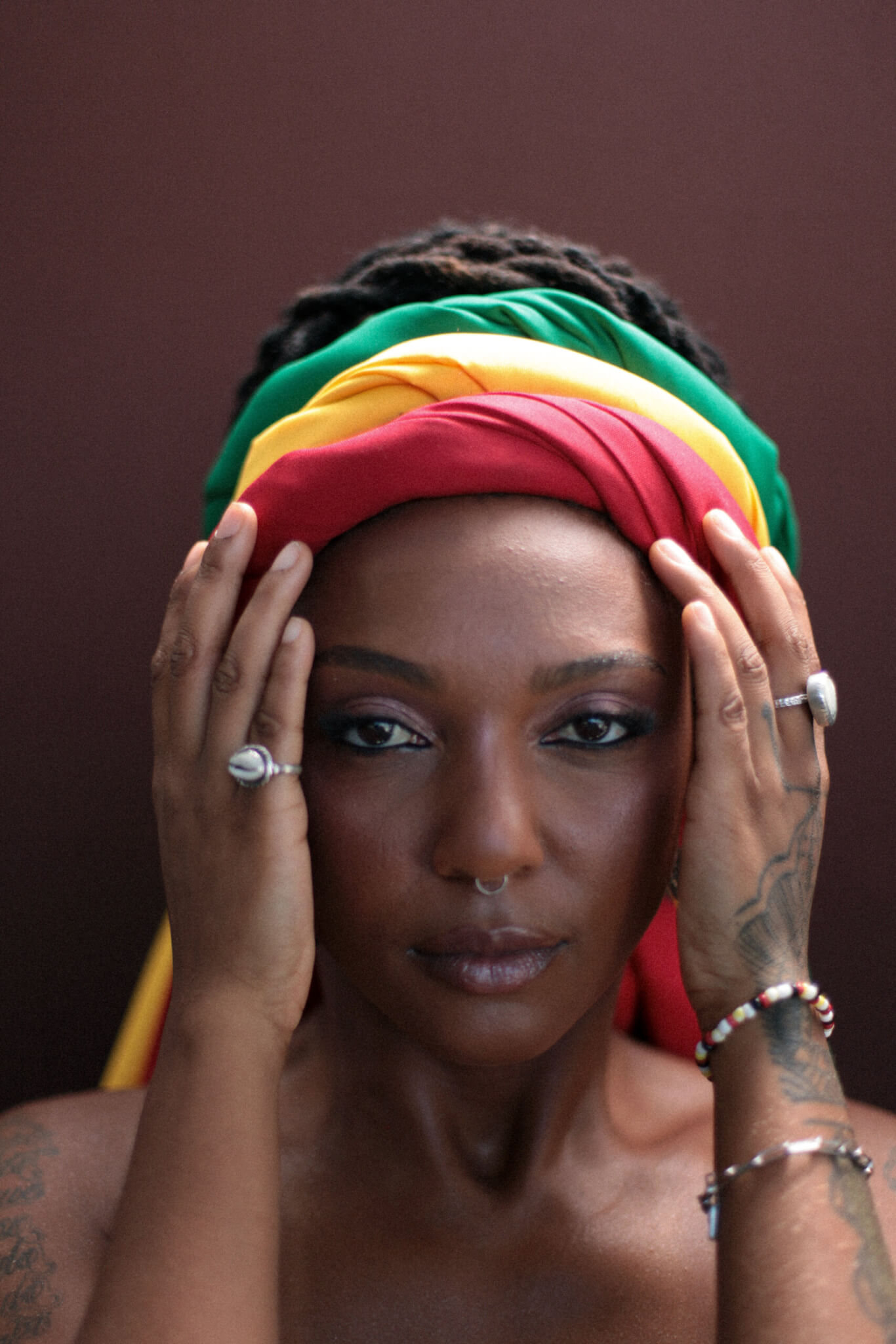 Members of Slavic Soul Party lying down in a circular formation holding instruments