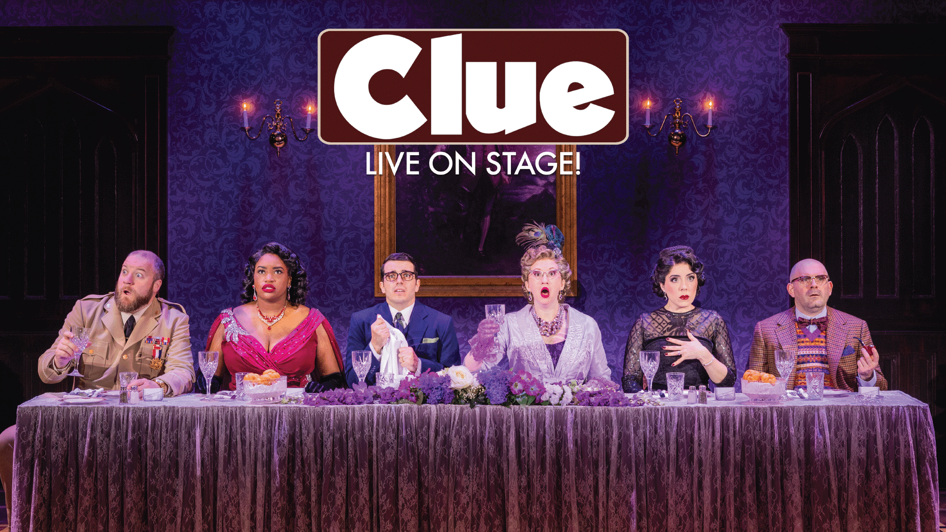 Six actors in colorful costumes, sit at a long dining table on stage, each with dramatic expressions. The backdrop is purple, and a “Clue LIVE ON STAGE!” sign hangs above them.