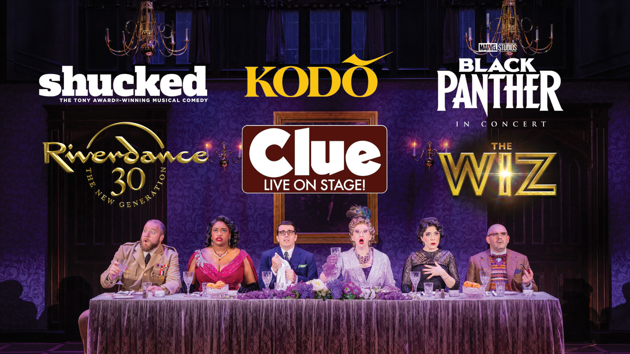 Six actors in formal attire sit at a long dining table on stage. Above them are logos for shows like Shucked, Kodo, Black Panther in Concert, Riverdance, Clue Live on Stage!, and The Wiz—highlighting upcoming performances with exclusive presale access.